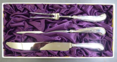 A loaded silver handled and stainless steel bladed, three piece carving set  modern London marks