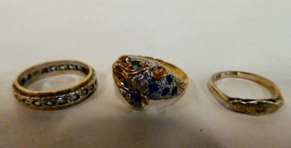 Three 9ct gold rings: to include an example, fashioned as big cats head and tail