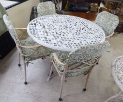 A white/cream painted metal terrace table   29"h  42"dia; and a set of four painted bamboo effect