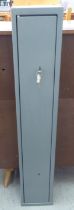 A grey enamelled steel, wall mounted shotgun safe with a hinged door and two keys  50"h