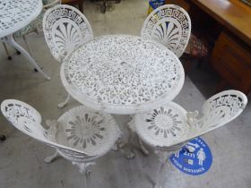 A Victorian style white painted, metal terrace table  26"h  29"dia; and a set of four matching