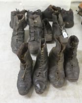 19thC studded leather lace-up work boots; and a set of four leather hoof covers