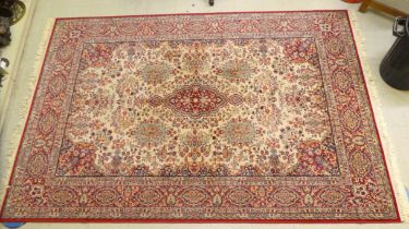 A Super Imperial Persian design rug with floral motifs, on a red ground  81" x 100"