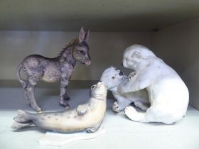 Kaiser pottery, viz. two playful cubs  5.5"h; a doleful donkey  6"h; and a seal  6"h