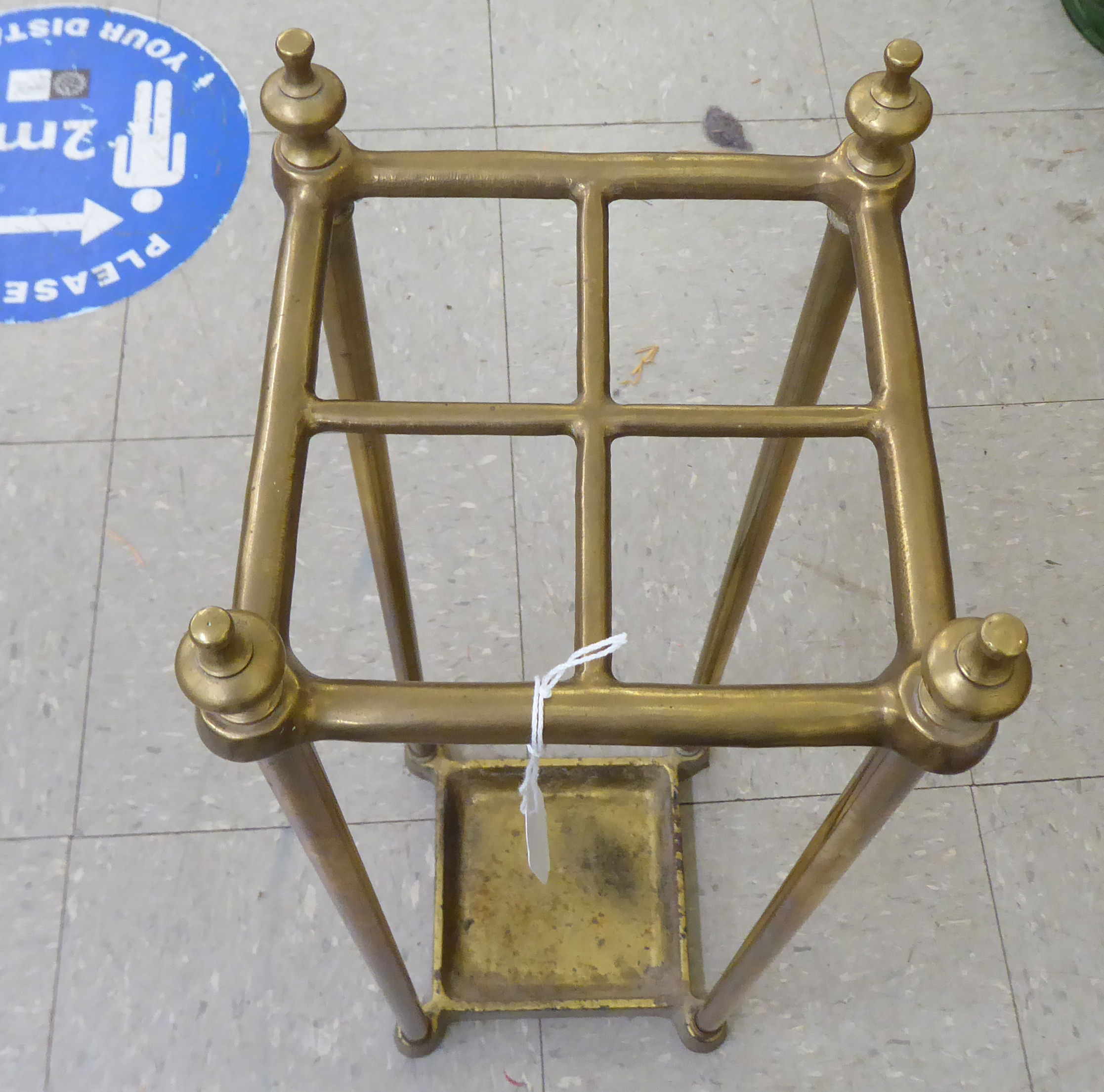 An early 20thC lacquered brass four division stickstand, on a gilded cast iron drip-tray  26"h - Image 2 of 2