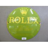 A yellow and green enamelled steel, convex, advertising sign for 'Rolex Submariner'  12"dia