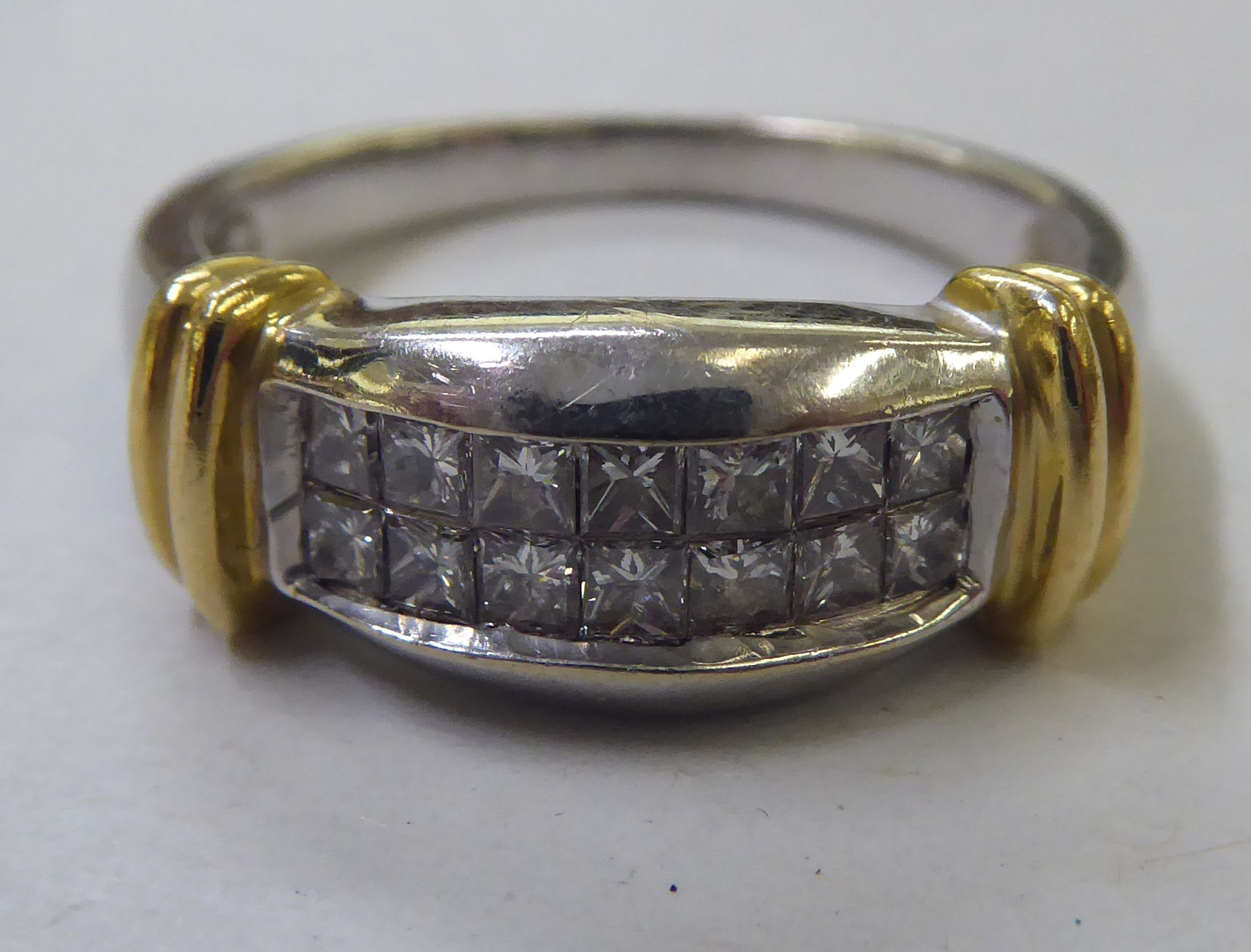 A bi-coloured gold diamond set ring  (stamped 18k)