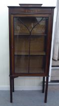 An Edwardian mahogany display cabinet with a glazed door, raised on square legs  52"h  23"w