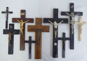 A small collection of variously sized and mounted crucifixes  tallest 14"h
