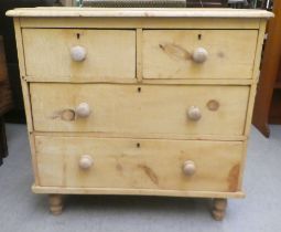 A late Victorian bleached, rustically constructed pine, four drawer dressing chest, raised on turned
