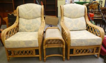 A pair of Daro faux bamboo framed conservatory chairs with high backs and swept arms and pastel
