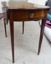A George III crossbanded string inlaid mahogany and shell marquetry Pembroke table, raised on