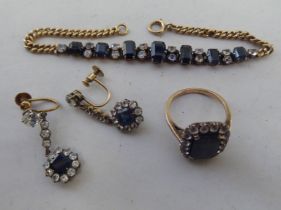 Yellow metal jewellery, viz. a cluster ring; a pair of earrings; and a bracelet, each set with