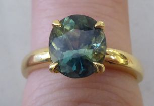 An 18ct gold sapphire ring, set with a sapphire