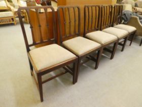 A set of five George III mahogany framed, triple splat back dining chairs with later fabric