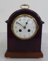 An Edwardian mahogany cased mantel clock; the 8 day movement faced by an enamelled Arabic dial  9"h