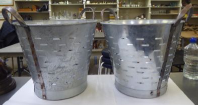 Two galvanised metal tapered and pierced grape collecting buckets with steel handles