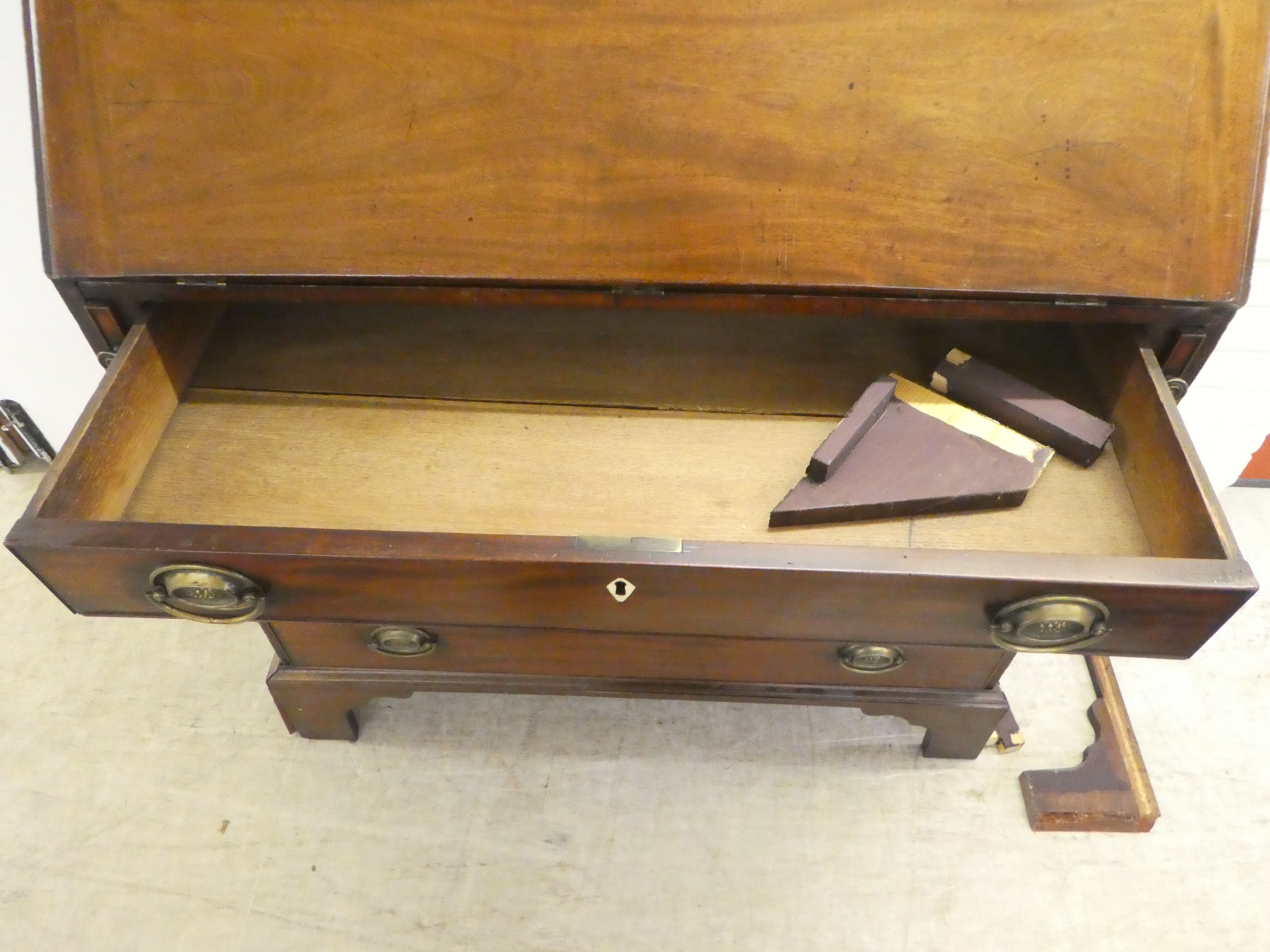 A George III mahogany bureau, the fall-flap enclosing four long graduated drawers, raised on bracket - Image 6 of 7