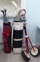 Golf clubs, bags and a trolley: to include putters and irons