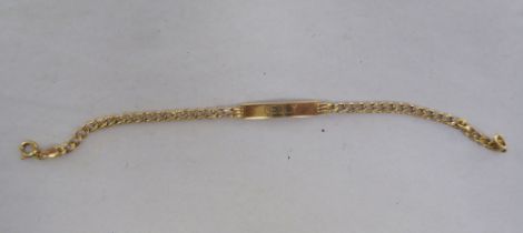 A 9ct gold curb link identity bracelet