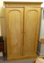 A late Victorian bleached pine, four-part, twin door wardrobe, on a plinth  82"h  50"w  22"deep