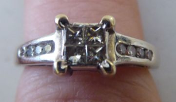 An 18ct white gold dour stone diamond ring