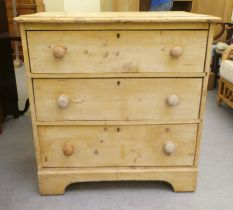 A late Victorian rustically constructed pine, three drawer dressing chest, raised on bracket feet