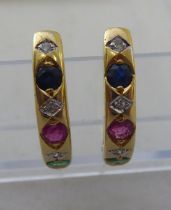 A pair of yellow metal, half-loop earrings, set with rubies, sapphires and diamonds