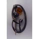 A Charles Horner silver wire thistle brooch, set with an amber coloured stone