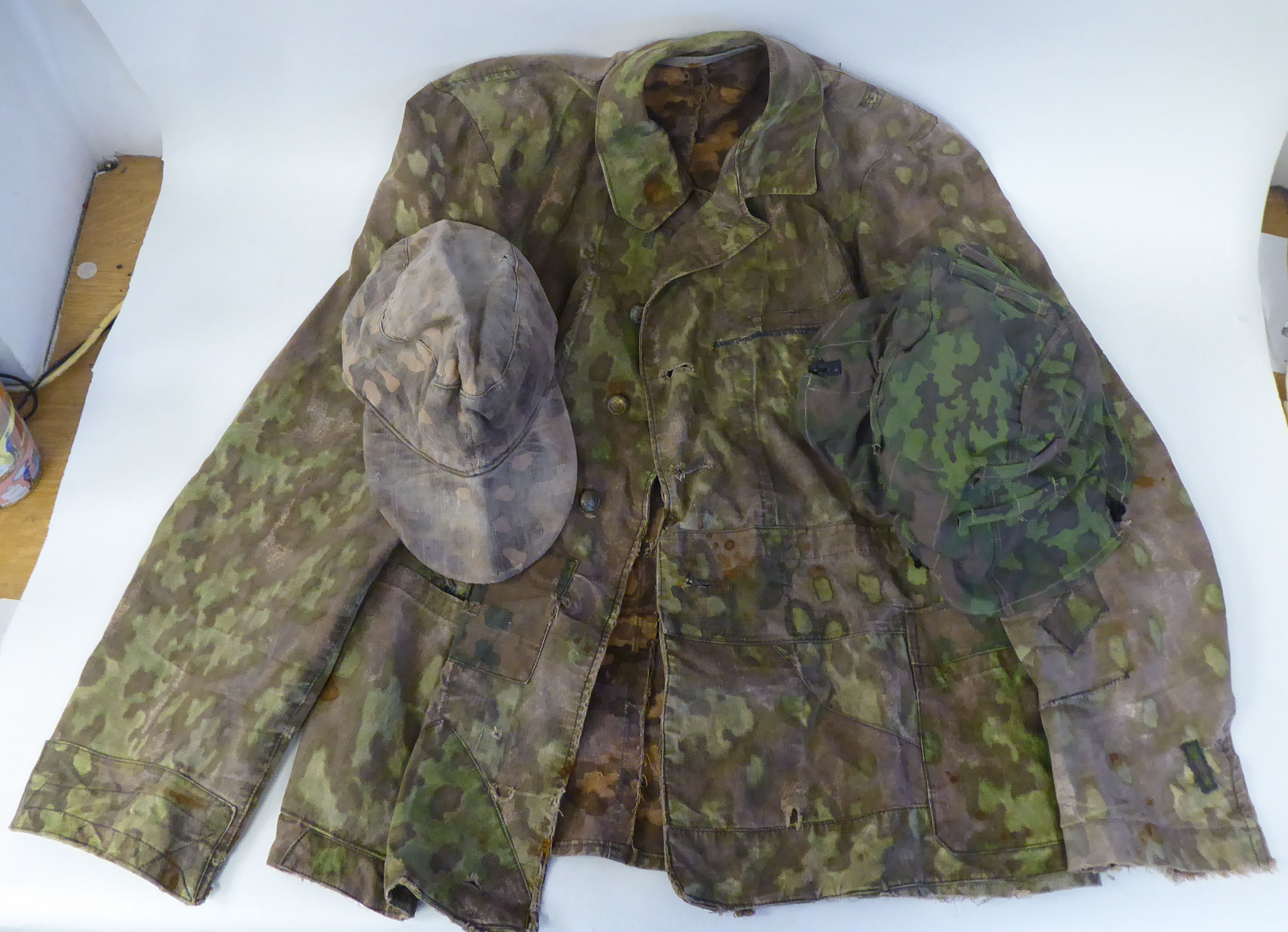 A German military camouflage smock, cap and helmet cover (Please Note: this lot is subject to the