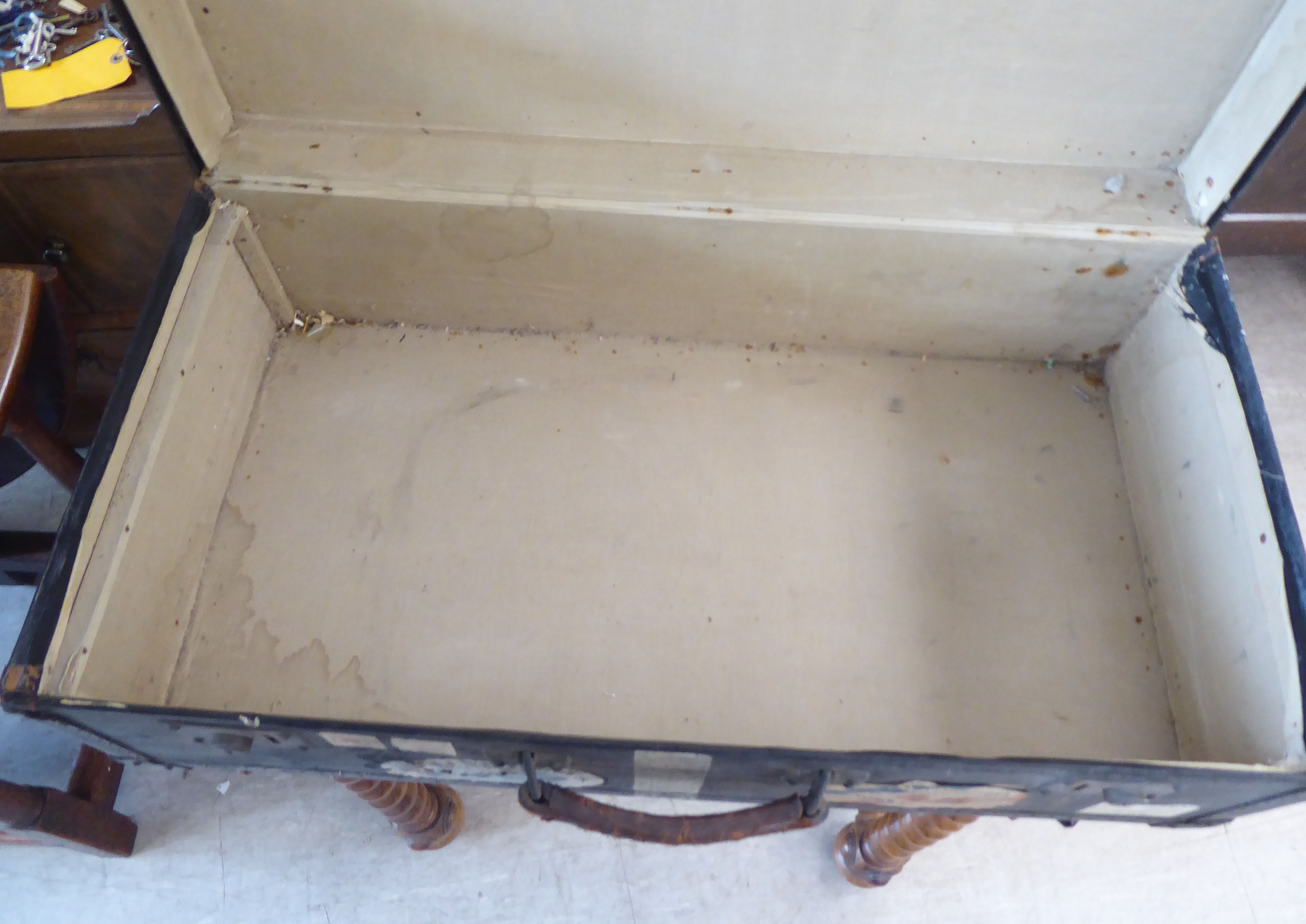 An early 20thC moulded/press composition travelling trunk with a hinged lid, bearing various - Image 9 of 9