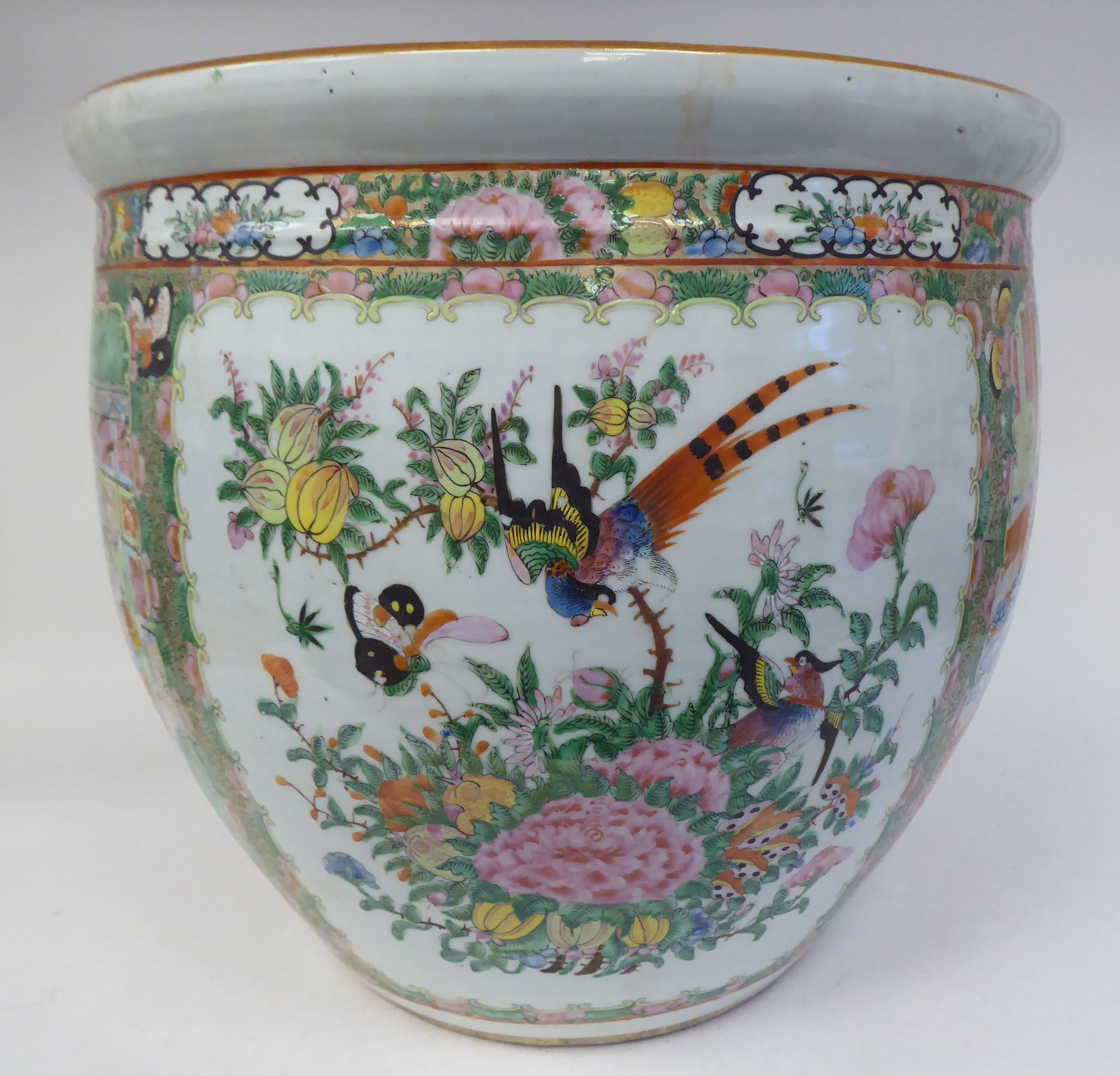 A 19thC Chinese Canton porcelain fish bowl, traditionally decorated in colours and alternating