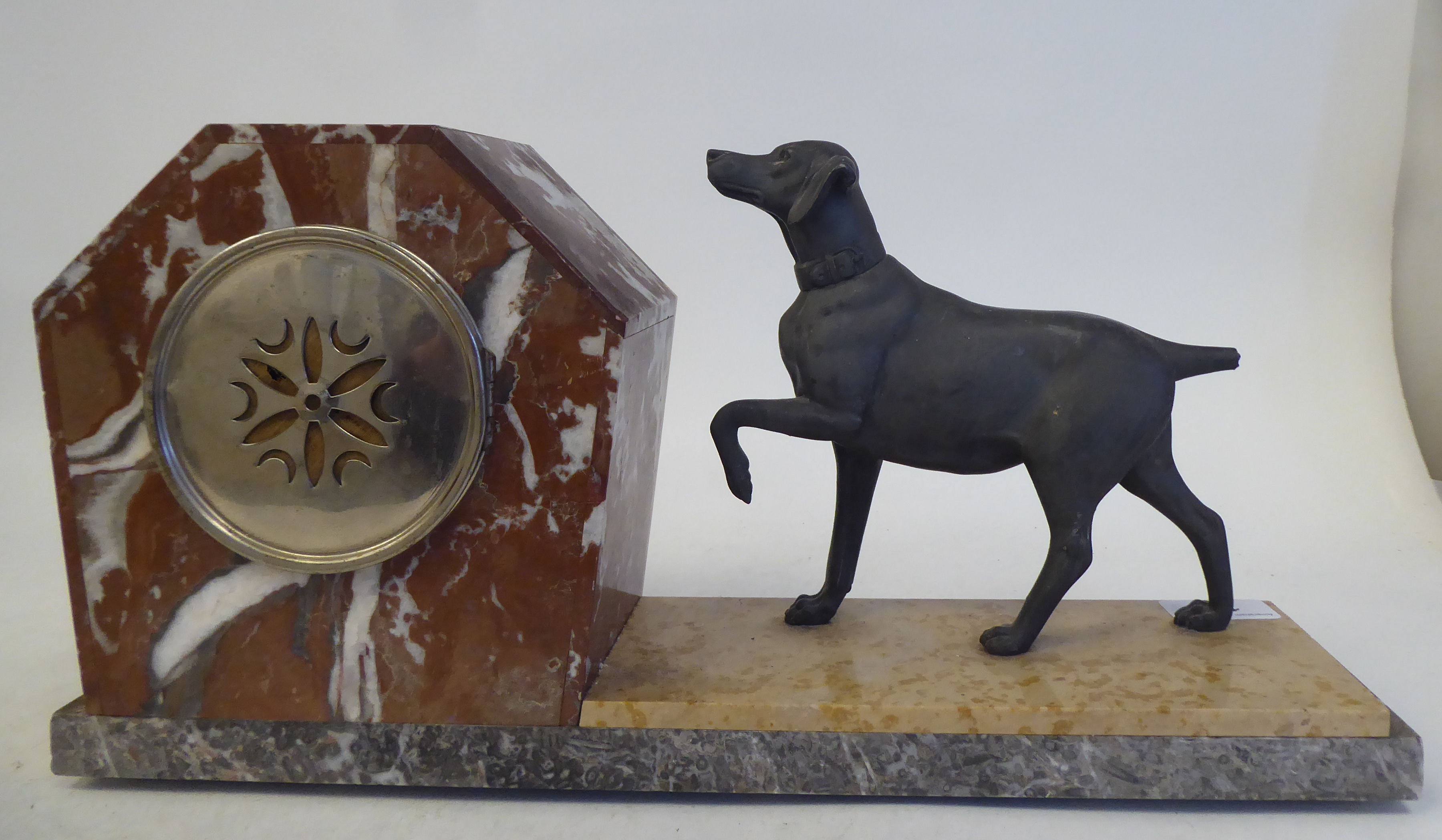 An Art Deco multi-coloured marble cased mantel clock, surmounted by a spelter standing hound; the - Image 6 of 8