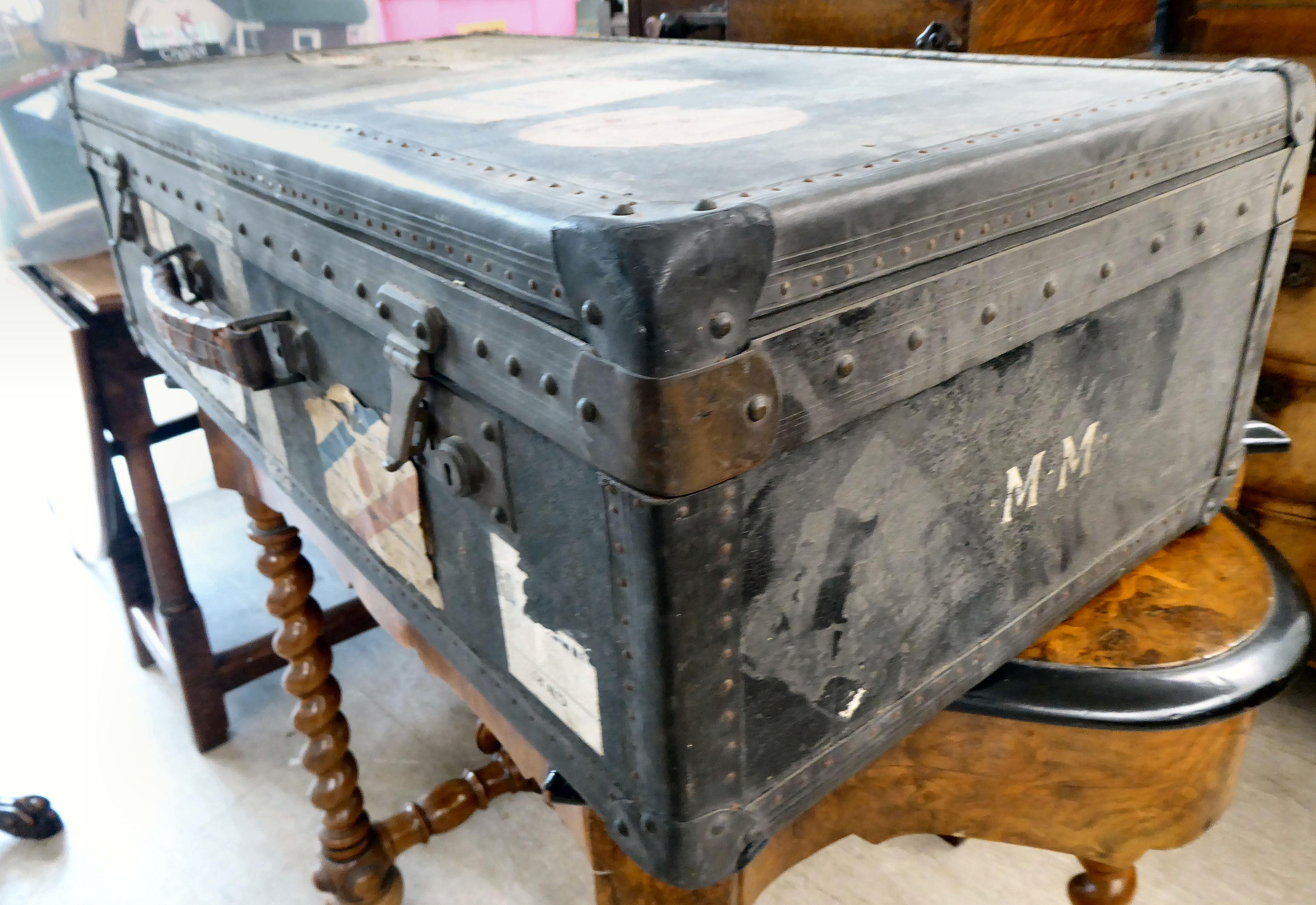 An early 20thC moulded/press composition travelling trunk with a hinged lid, bearing various - Image 6 of 9