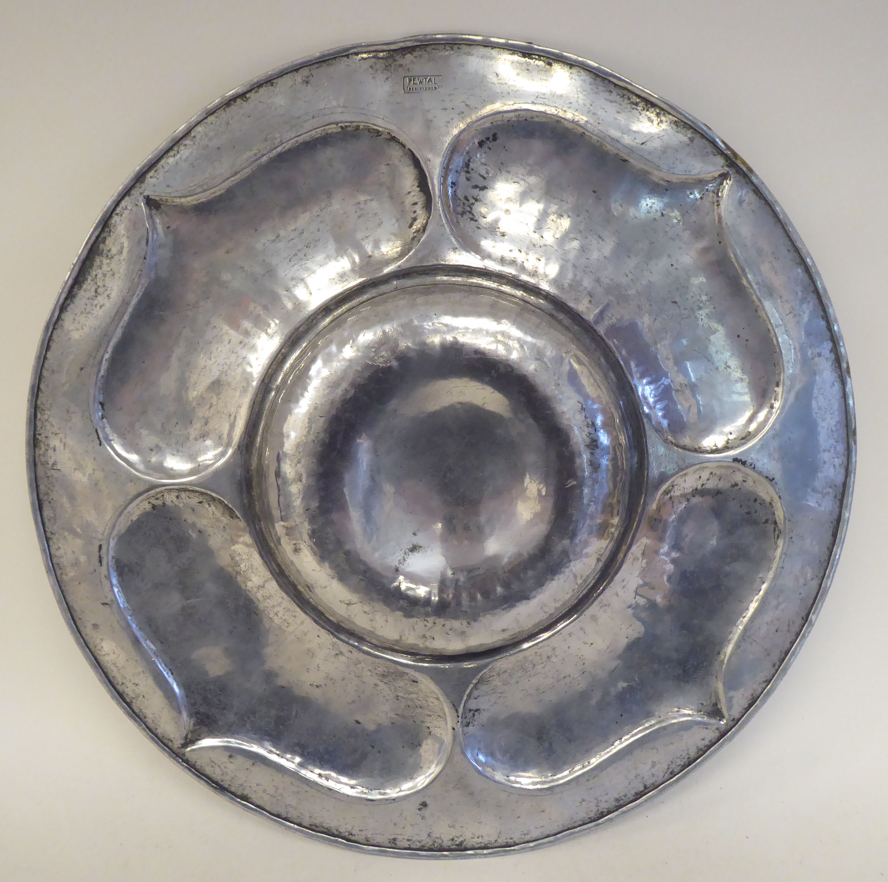 A Pewtal dish with a depressed centre, the wide rim ornamented in Art Nouveau inspired designs  15" - Image 2 of 3