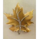 A Birks 14ct gold maple leaf design brooch, set with diamonds