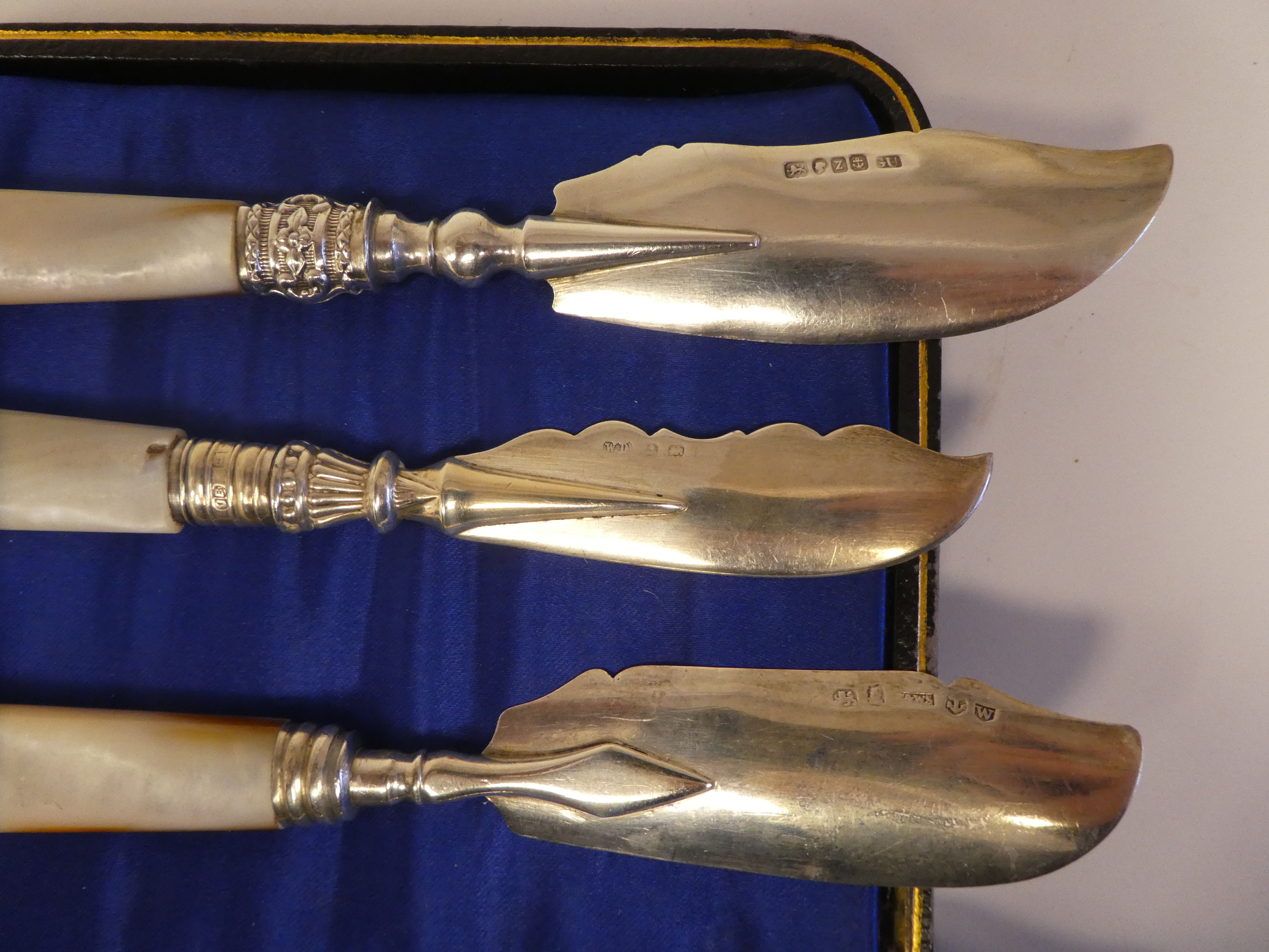 A set of six silver dessert knives, on mother-of-pearl handles  cased; and a matched set of - Image 6 of 7