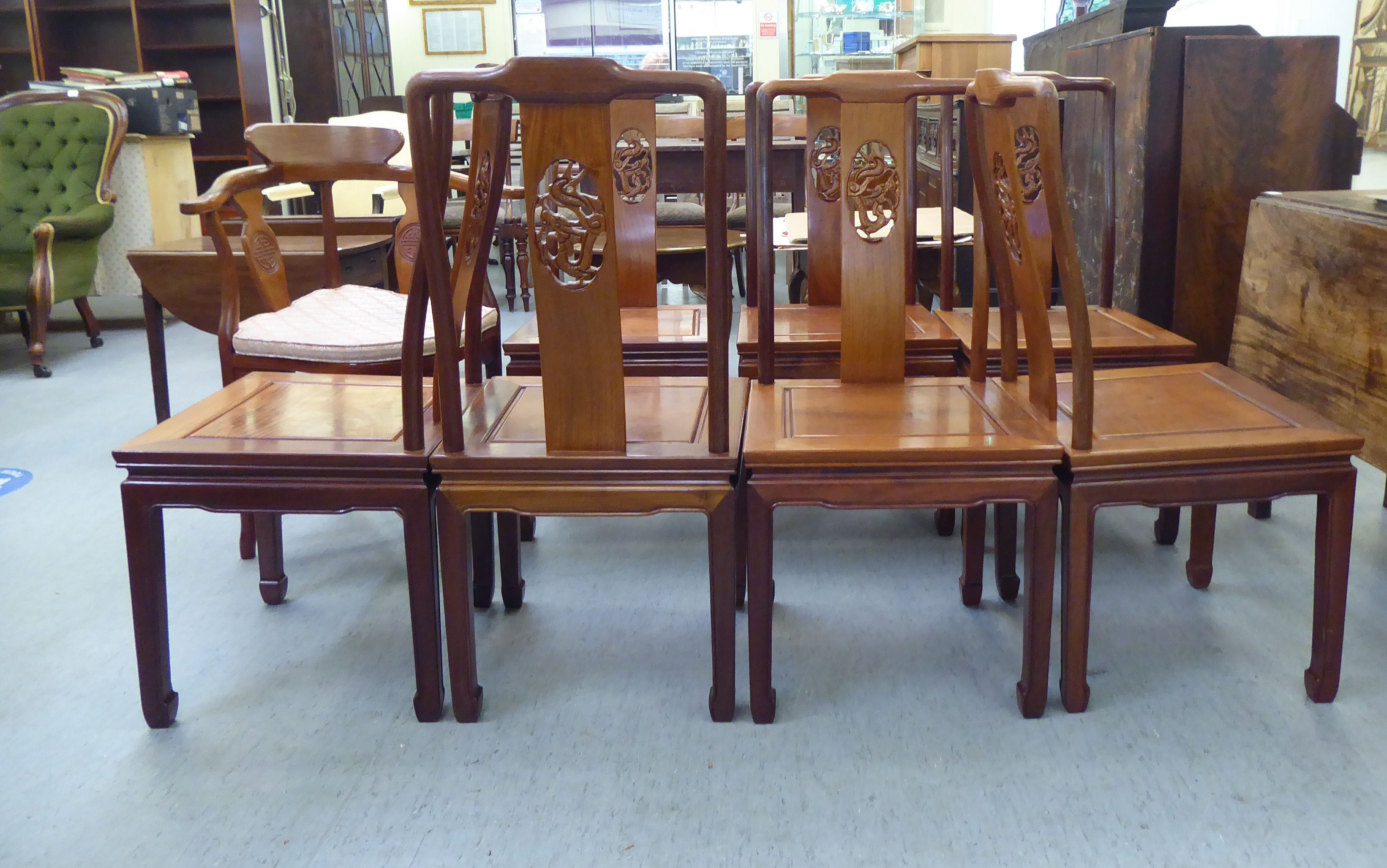 A set of seven modern Chinese, rosewood framed dining chairs, each with a dragon carved splat, - Image 3 of 5