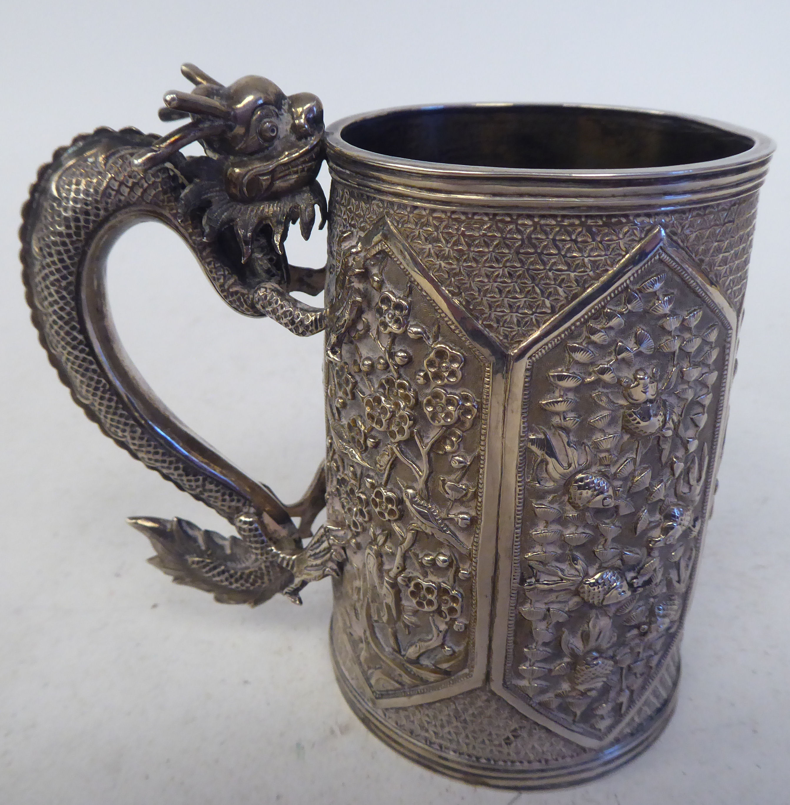 A late 19thC Chinese silver coloured metal mug of tapered cylindrical form with a cast S-shape - Image 3 of 4