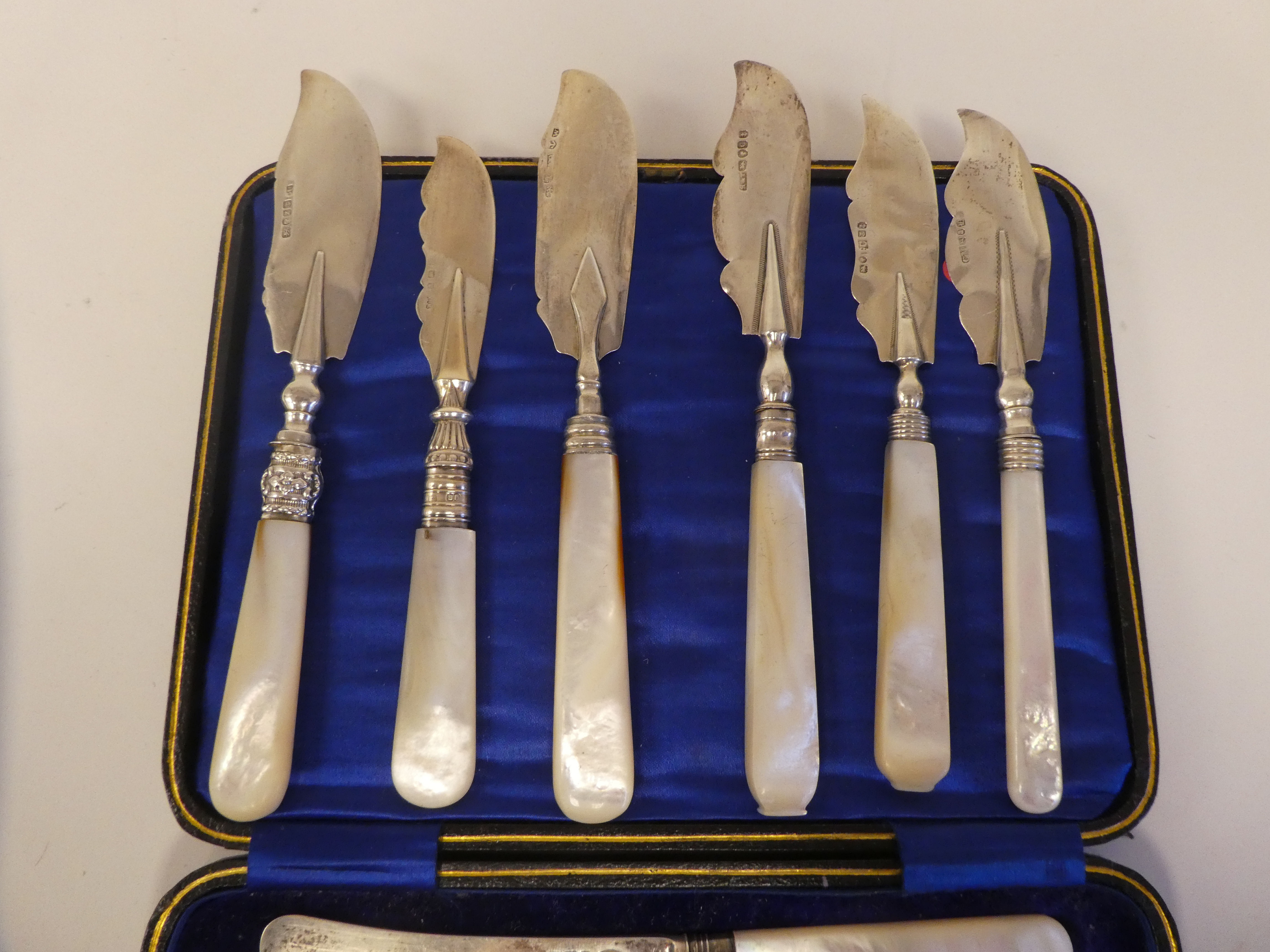 A set of six silver dessert knives, on mother-of-pearl handles  cased; and a matched set of - Image 4 of 7