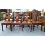 A set of seven modern Chinese, rosewood framed dining chairs, each with a dragon carved splat,