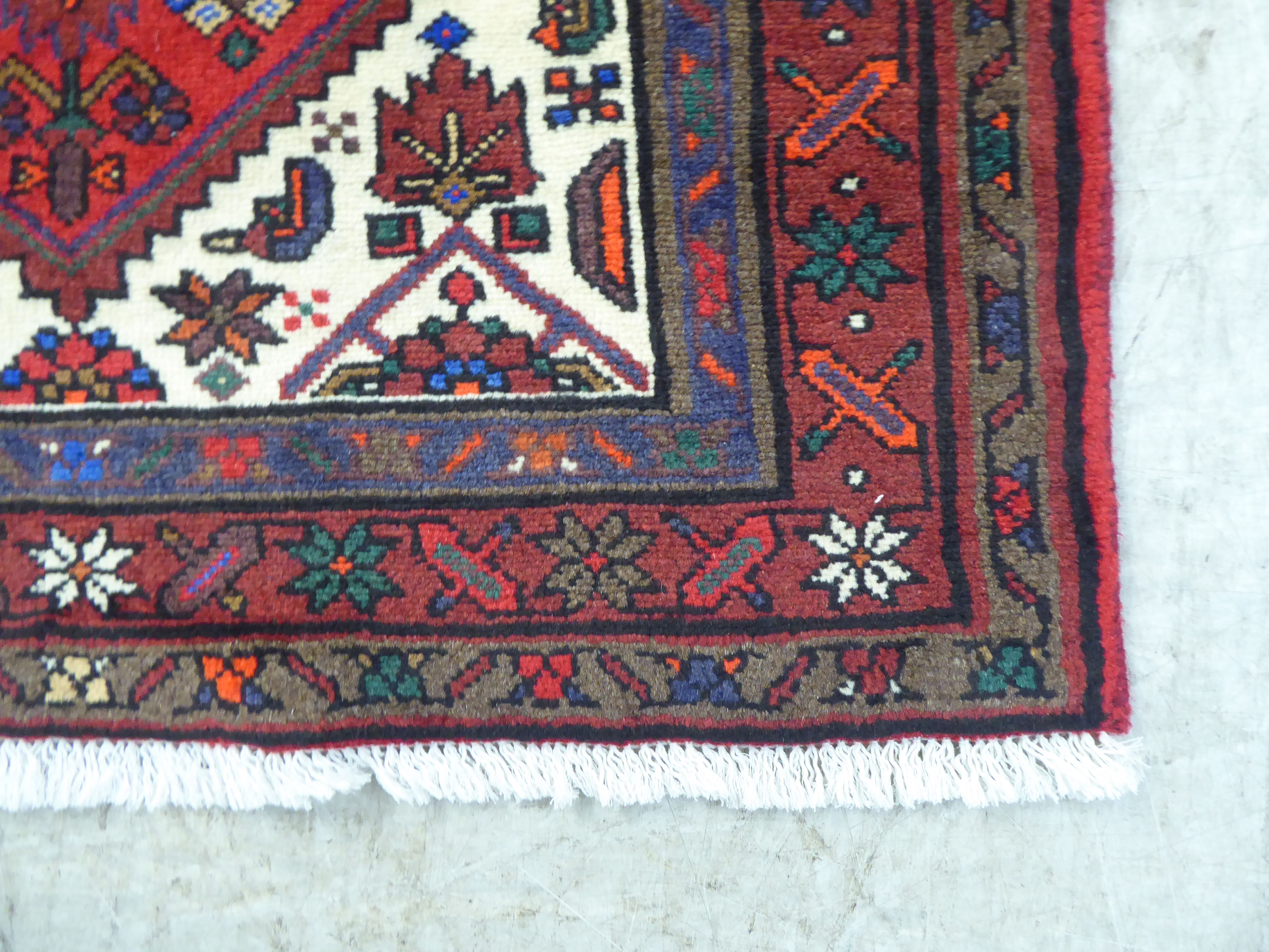 A Persian rug, on a red ground  37" x 59" - Image 3 of 4