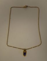 A 9ct gold, fine box link necklace, suspending an enamelled blue scarab beetle
