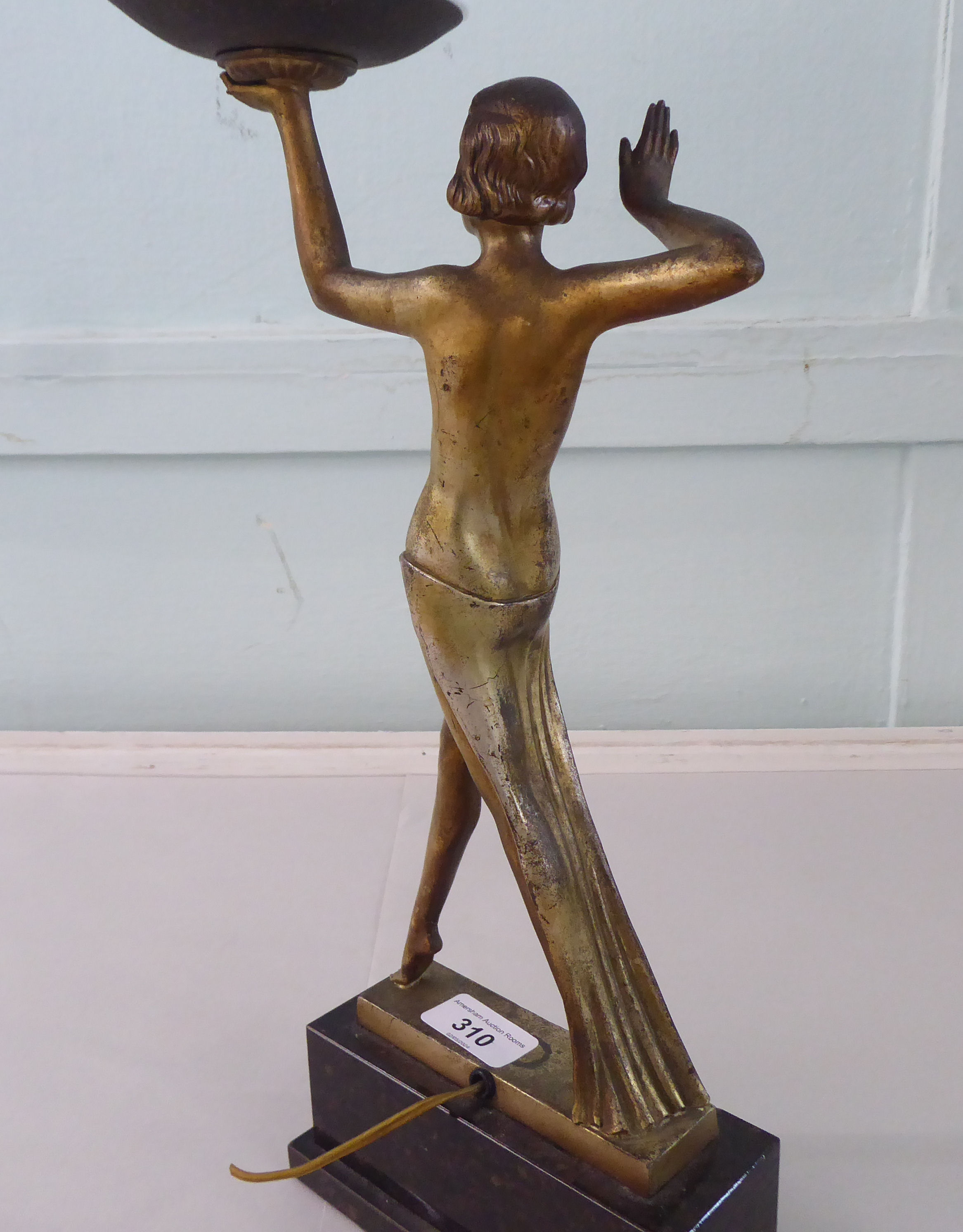 A 1930s Art Deco patinated and gilded table lamp. fashioned as a woman holding a white glass - Image 5 of 5