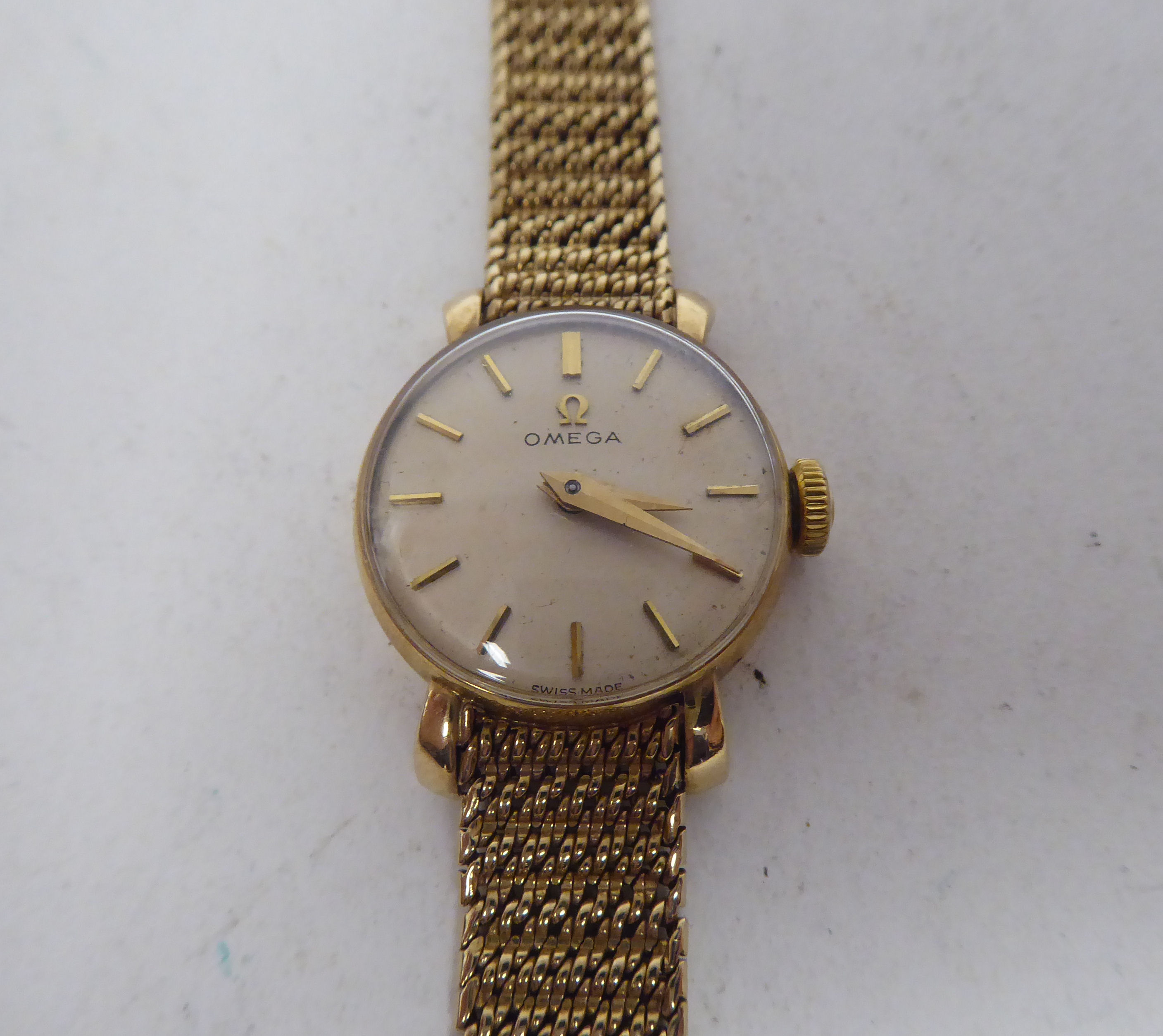 A lady's Omega 9ct round cased bracelet wristwatch, the manual wind mechanism faced by a baton dial - Image 2 of 7