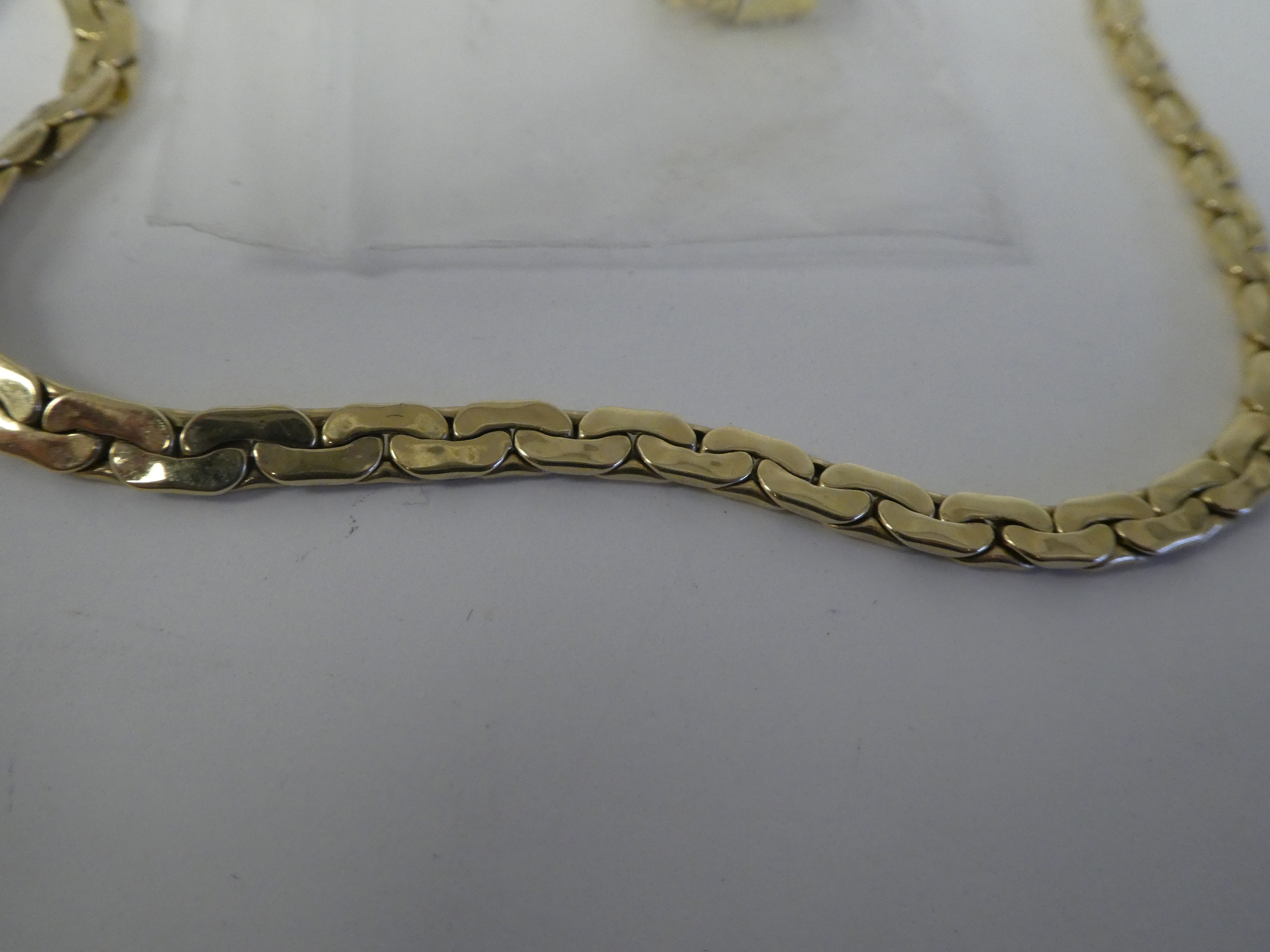 A 14ct gold flexible, fancy link neckchain, on a double dog clip clasp - Image 4 of 4
