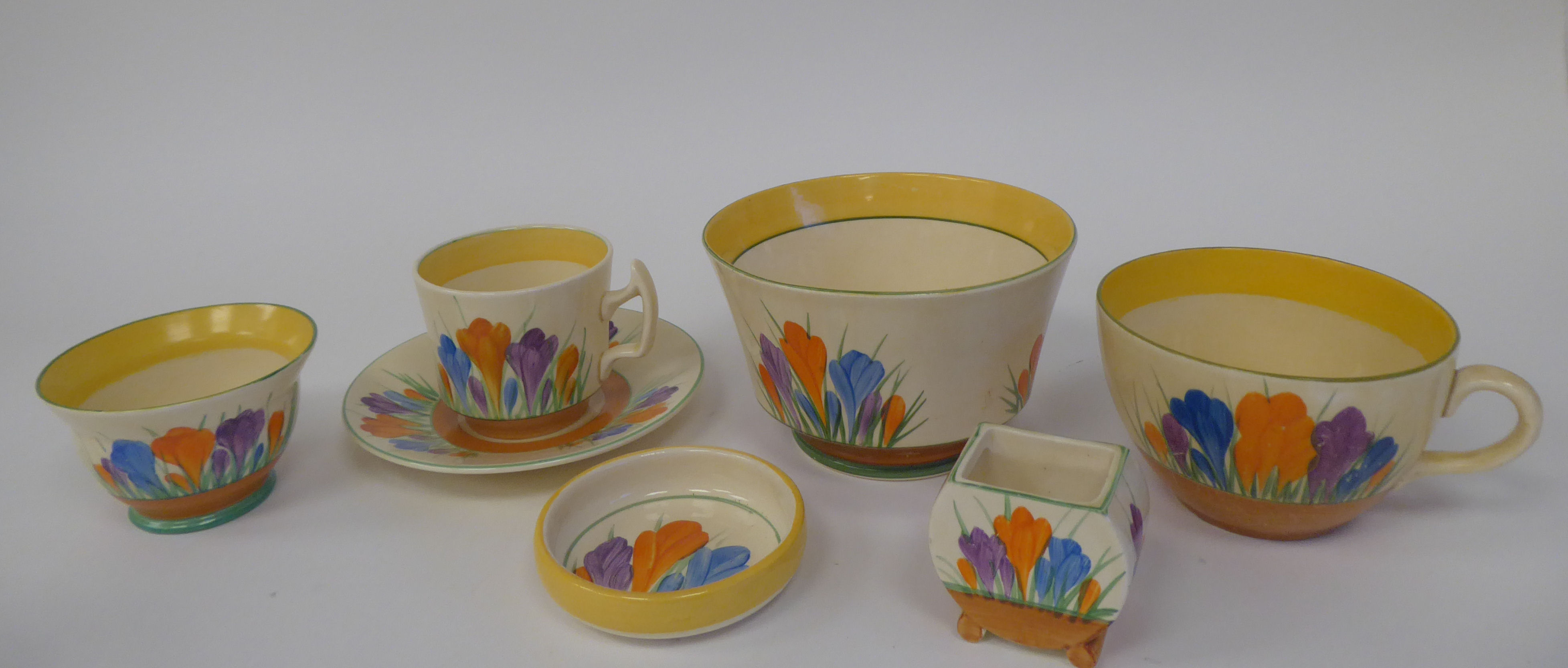 Clarice Cliff Bizarre, Newport Pottery, Crocus pattern items, viz. a toothpick pot; a tea cup; a