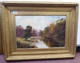 Clifford Roberts - a riverscape with grazing sheep in a woodland setting  oil on canvas  bears a