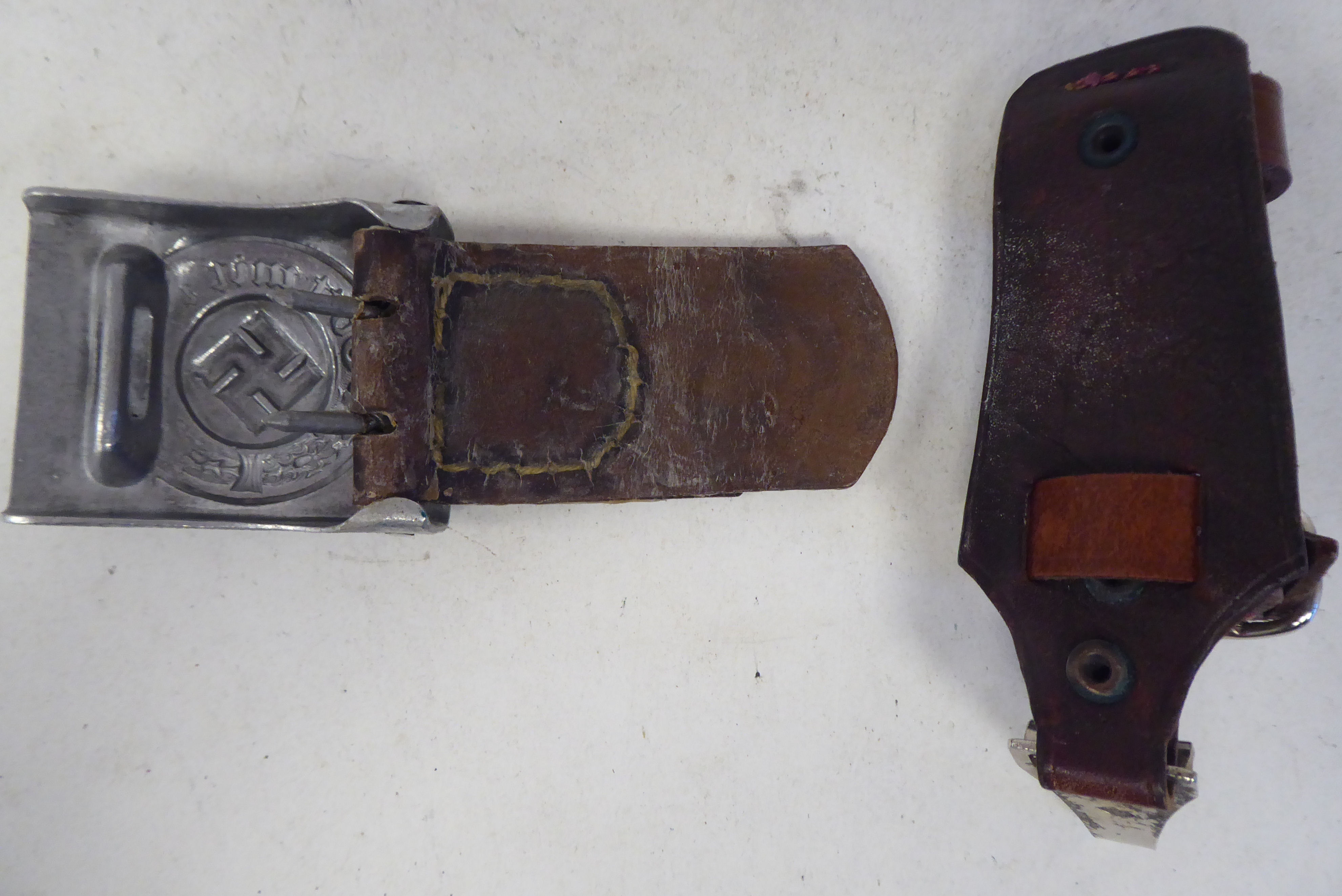 A German Third Reich era military belt buckle; and a buckled brown hide dagger strap (Please Note: - Image 2 of 2
