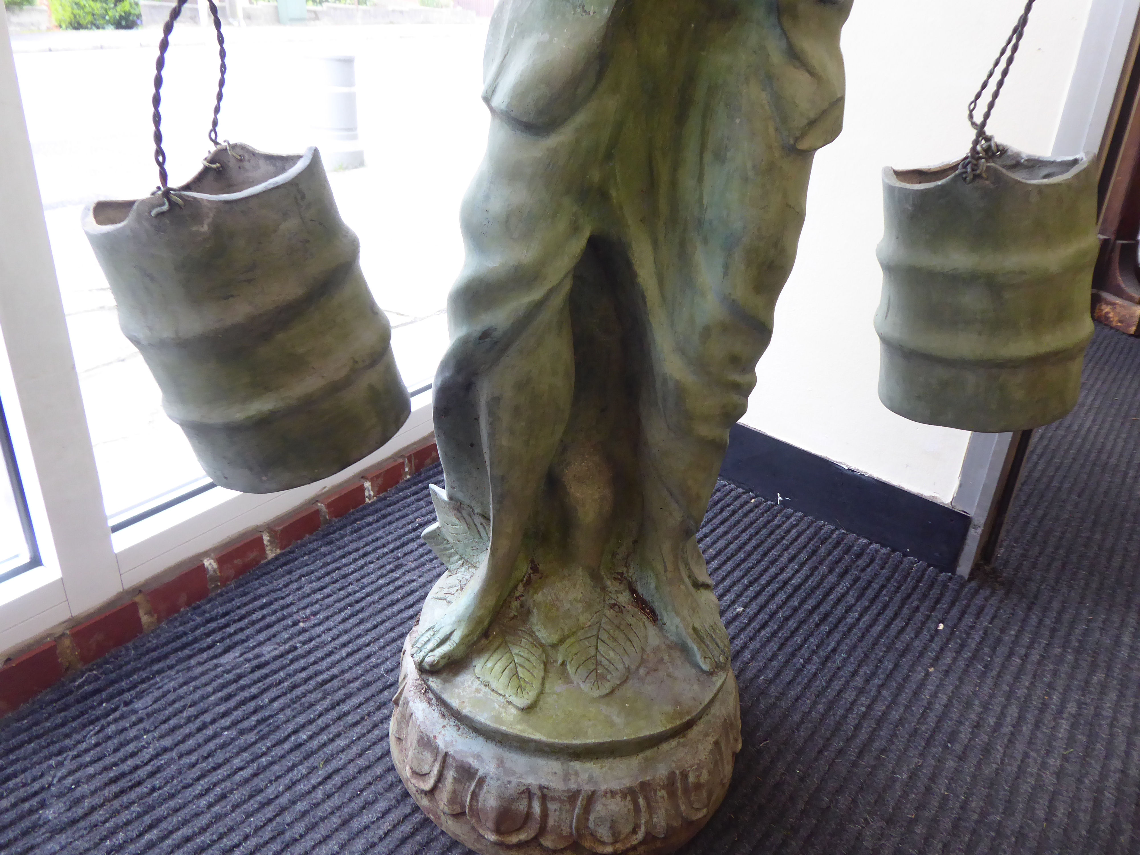 A 20thC cast and patinated green bronze standing Asian artisan figure, a bearded man, carrying two - Image 3 of 4